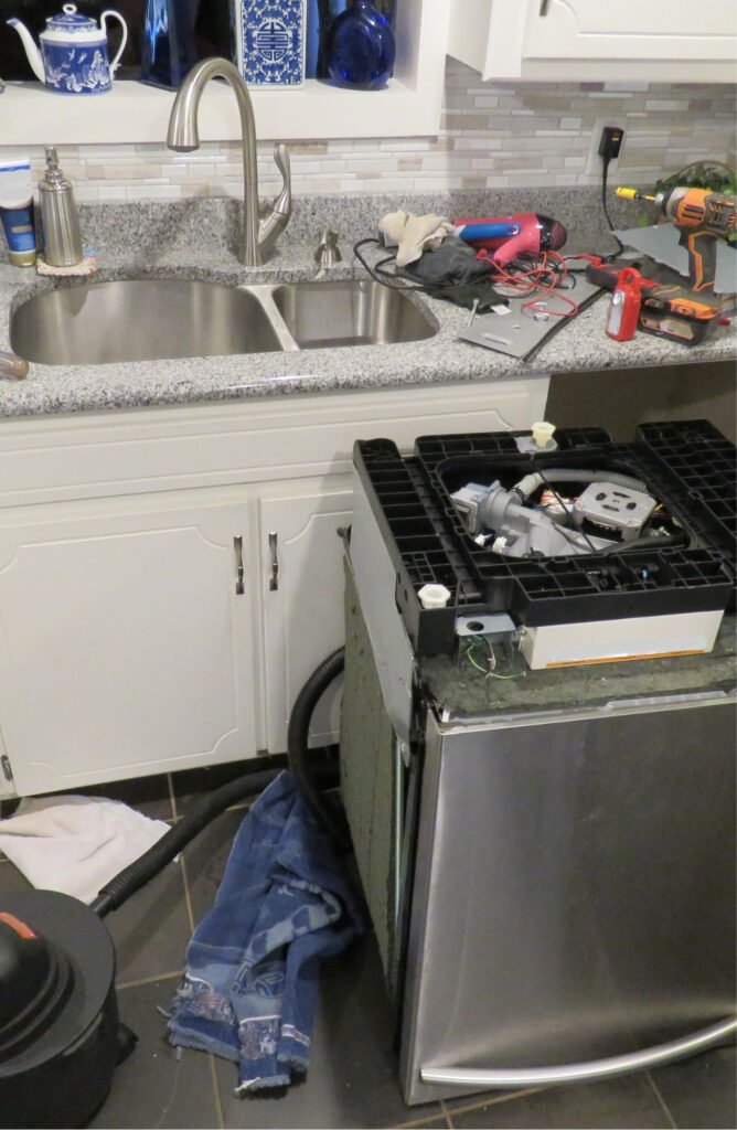 appliance-repair-job-being-undertaken-in-kitchen